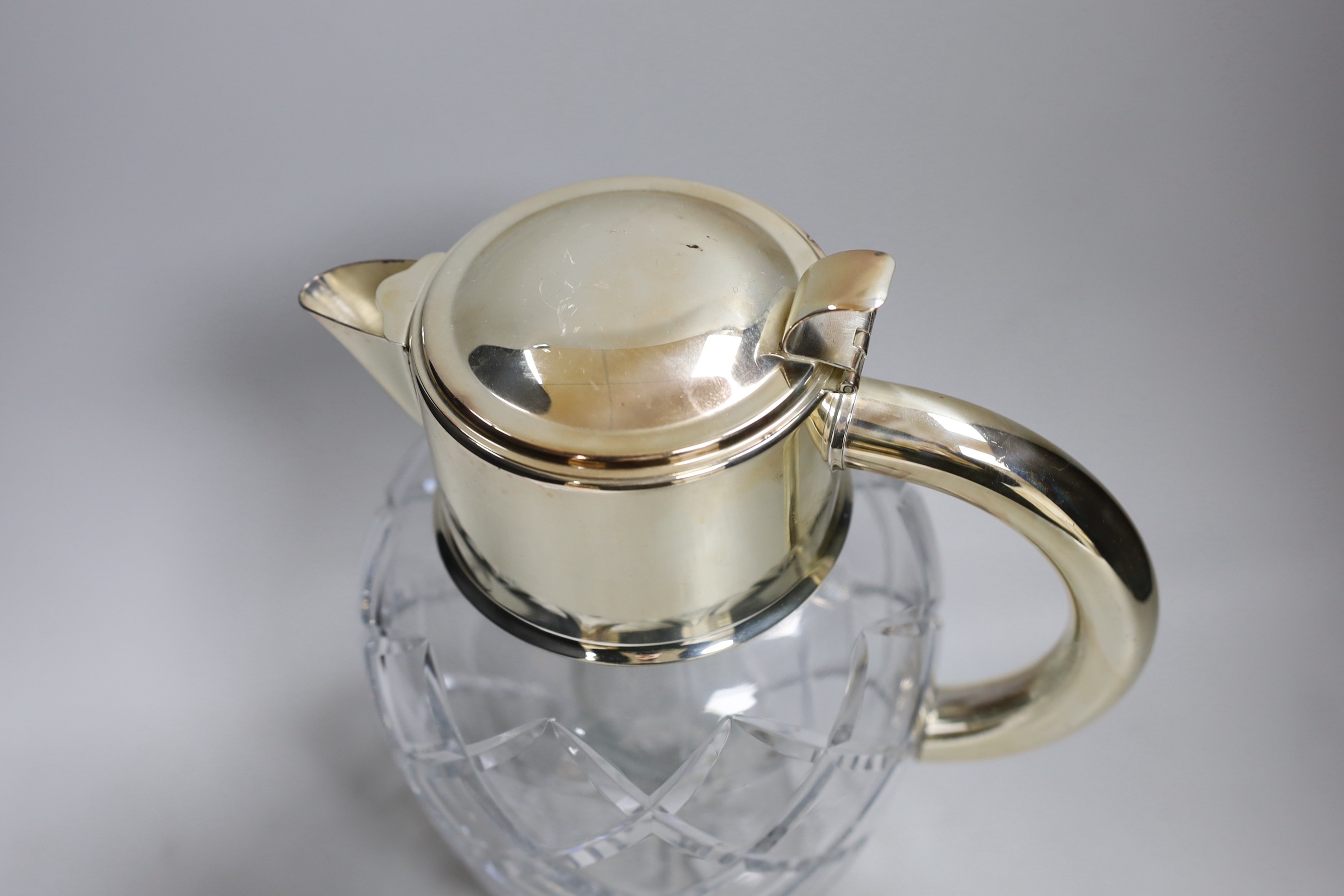 A large cut glass and silver plated jug, possibly for Pimms. 28cm tall